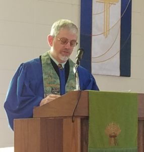 Rev. Pasley in worship